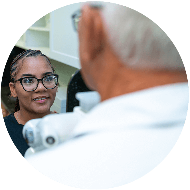 team member taking a dental x-ray of Patient