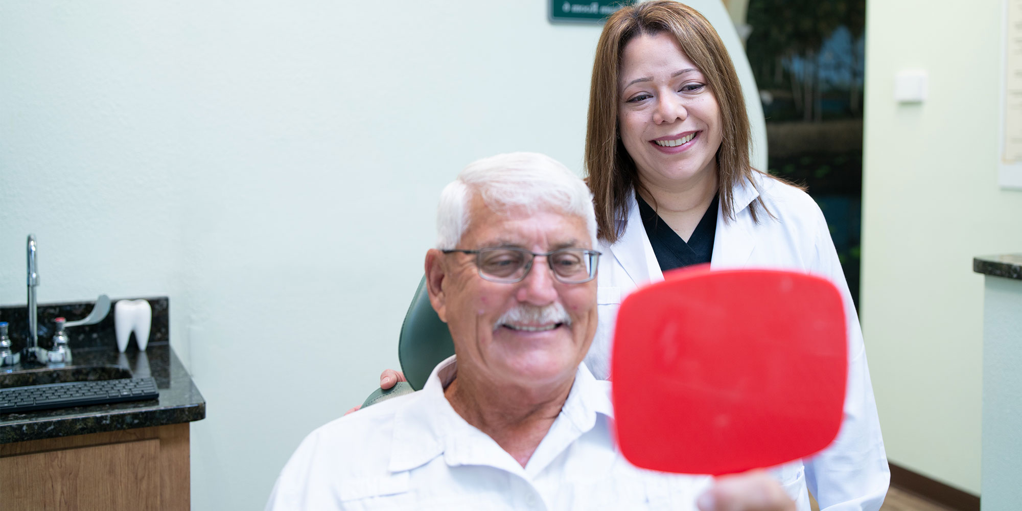 Doctor and Patient looking into mirror